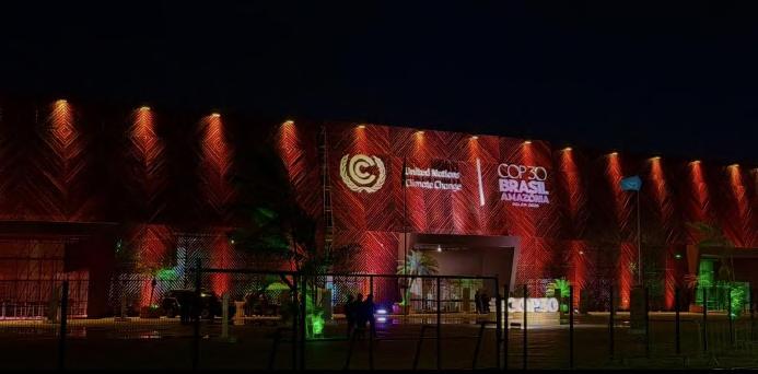 COP 30 venue in Belém lit in red at night